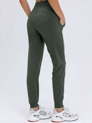 Chic and Functional: Trendy Tied Joggers with Versatile Pockets - Très Elite