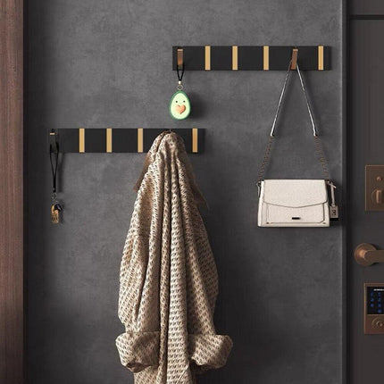 Elegant Black and Gold Foldable Wall Hook Rack for Stylish Storage Solutions - Très Elite