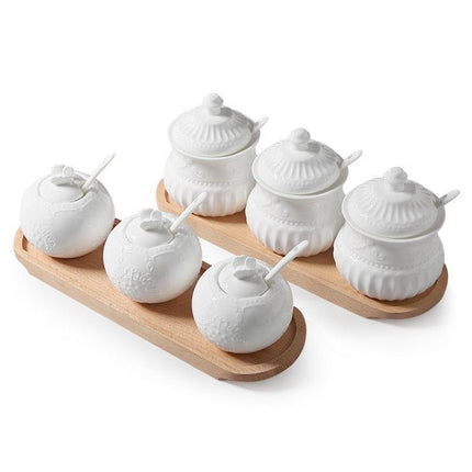 Elegant Butterfly Ceramic Spice Jar Set with Embossed Designs, Measuring Spoons, and Secure Lids for Chic Kitchen Storage - Très Elite