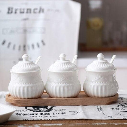 Elegant Butterfly Ceramic Spice Jar Set with Embossed Designs, Measuring Spoons, and Secure Lids for Chic Kitchen Storage - Très Elite