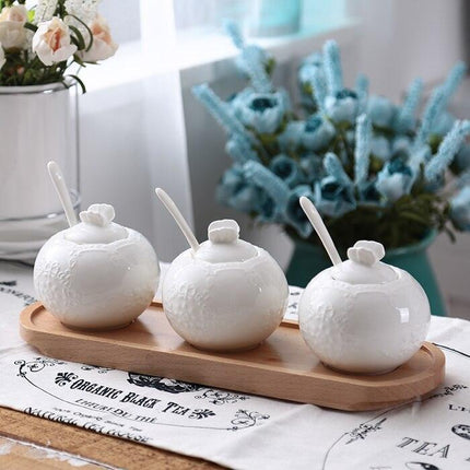 Elegant Butterfly Ceramic Spice Jar Set with Embossed Designs, Measuring Spoons, and Secure Lids for Chic Kitchen Storage - Très Elite