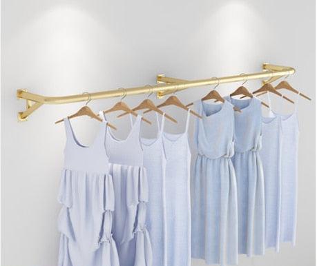 Elegant Wall-Mounted Clothing Rack for Stunning Women's Fashion Displays in Your Boutique