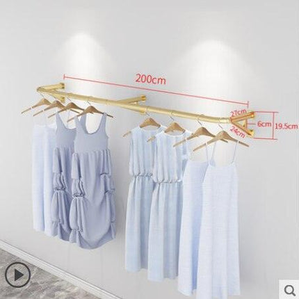 Elegant Wall-Mounted Clothing Rack for Stunning Women's Fashion Displays in Your Boutique