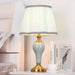 Sophisticated Metal Base Table Lamp with Fabric Shade for Elegant Home Lighting