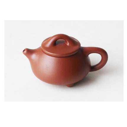 Whimsical Purple Clay Teapot Ensemble with Charming Tea Pet