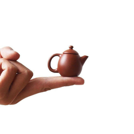 Whimsical Purple Clay Teapot Ensemble with Charming Tea Pet