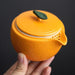 Orange Ceramic Tea Set for Travelers - Teapot, Cups, and Pitcher for On-the-Go Tea Enjoyment