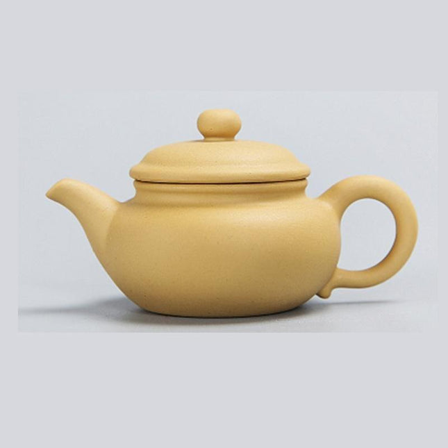 Whimsical Purple Clay Teapot Ensemble with Charming Tea Pet