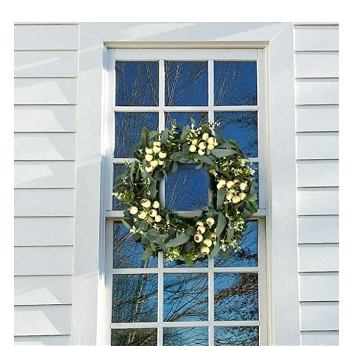 Festive Holiday Cheer: Elegant Christmas Wreath Display for Your Door
