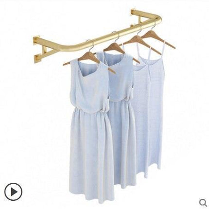 Elegant Wall-Mounted Clothing Rack for Stunning Women's Fashion Displays in Your Boutique