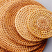 Sophisticated Artisanal Rattan Coasters with Elegant Weave Pattern