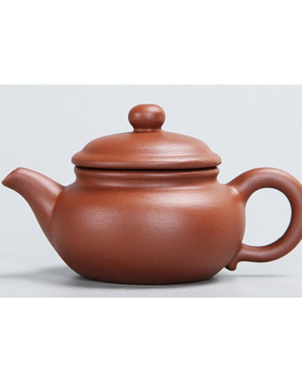 Whimsical Purple Clay Teapot Ensemble with Charming Tea Pet