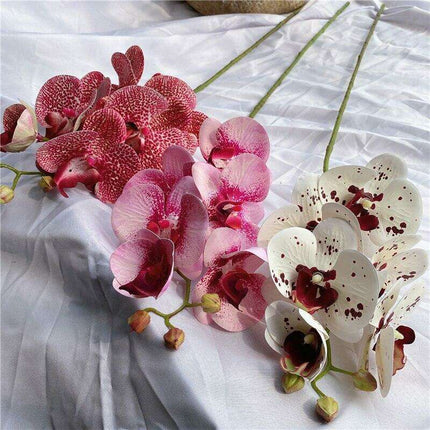 Sophisticated Elegance: Lifelike Faux Orchid Stem for Timeless Home Decor