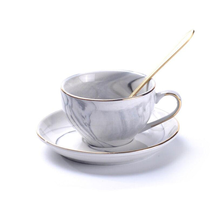 Elegant Porcelain Tea Set with Marbled Design and Gold Trim