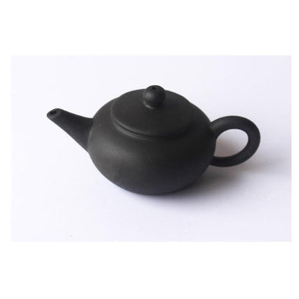 Whimsical Purple Clay Teapot Ensemble with Charming Tea Pet