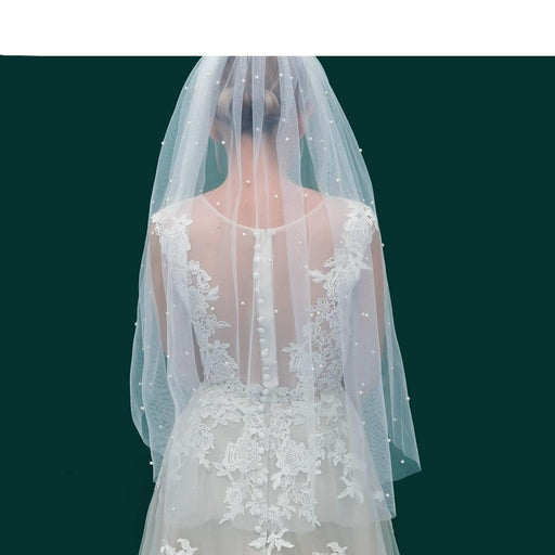 Ethereal Botanica Bridal Tulle Veil with Pearl Embellishments and Hair Accessory