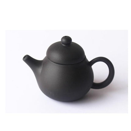Whimsical Purple Clay Teapot Ensemble with Charming Tea Pet