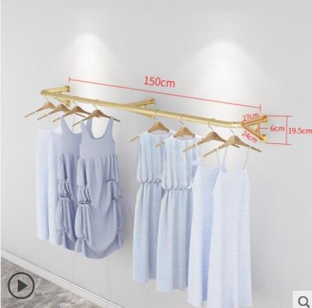 Elegant Wall-Mounted Clothing Rack for Stunning Women's Fashion Displays in Your Boutique