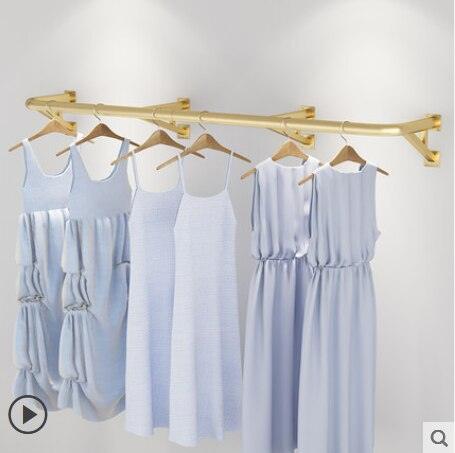 Enhance Your Store's Women's Clothing Display with a Chic Wall-Mounted Clothes Rack