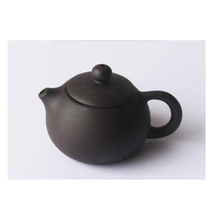 Whimsical Purple Clay Teapot Ensemble with Charming Tea Pet