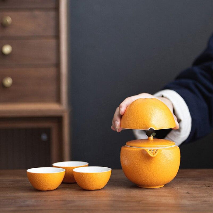 Orange Ceramic Travel Tea Set with Teapot, Cups, and Pitcher