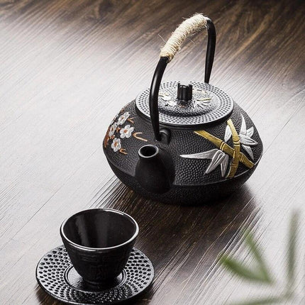 Elegant Japanese Cast Iron Tea Kettle Set with Plum and Bamboo Design - Complete Tea Serving Collection