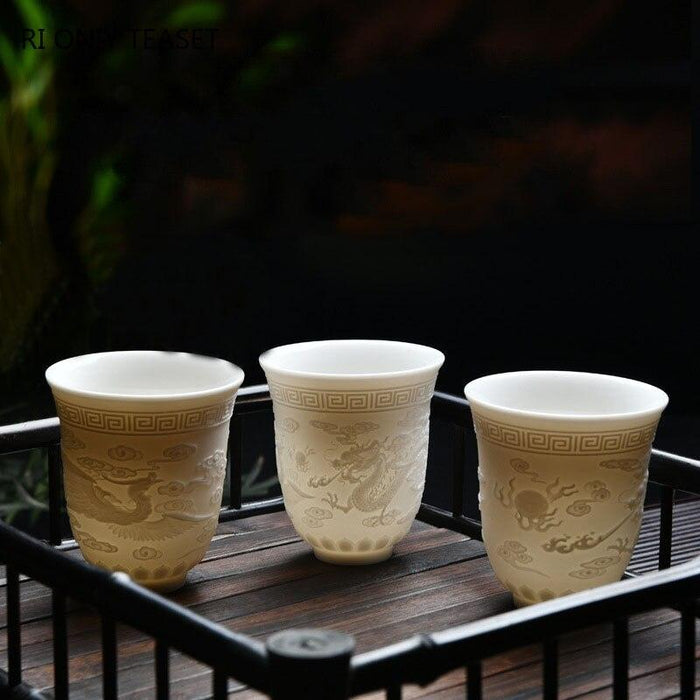 Exquisite PSuet Jade White Porcelain Teacup with Elegant 3D Relief Design