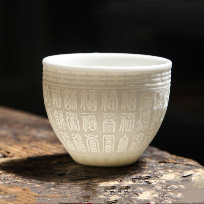 Elegant Handcrafted White Porcelain Teacup with 3D Relief Design - Available in Four Sizes