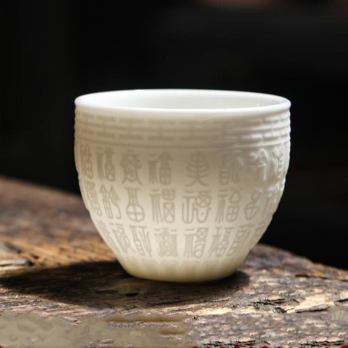 Exquisite PSuet Jade White Porcelain Teacup with Elegant 3D Relief Design