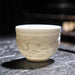 Elegant Handcrafted White Porcelain Teacup with 3D Relief Design - Available in Four Sizes