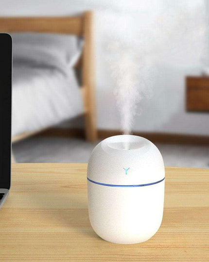 Compact Ultrasonic Essential Oil Diffuser - Mini AromaBreeze Humidifier with LED Light for Travel Relaxation