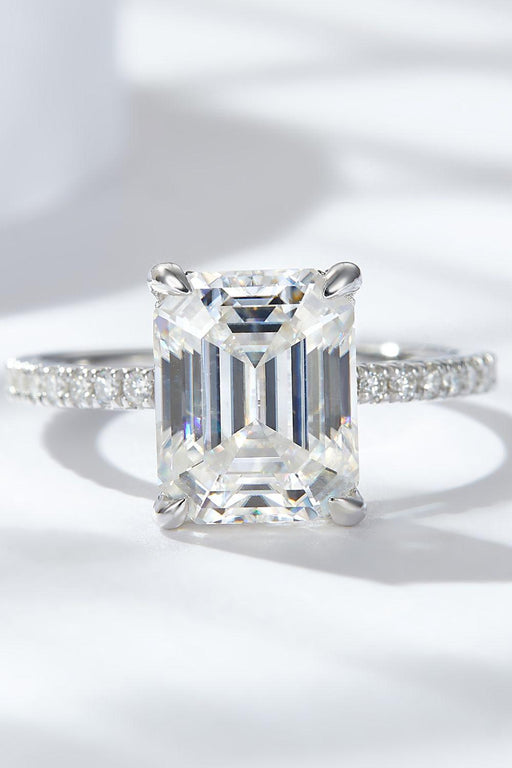 Elegance Personified: 4 Carat Emerald Cut Moissanite Ring with Side Stones