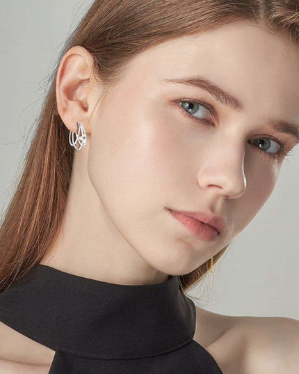 Lavish Moissanite Teardrop Earrings with Lab-Diamond Accents in White Gold and Yellow Gold Plating