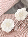 Elegant White Camellia Earrings with Pearl Embellishments