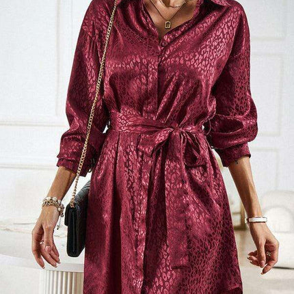 Elegant Button-Up Dress with Sophisticated Collar and Unique Self-Pattern